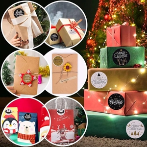 Detailed view of Merry Christmas stickers on gift boxes and envelopes for holiday decor