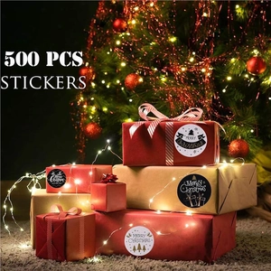 Roll of 500 Merry Christmas stickers with holiday trees and gift box patterns for packing