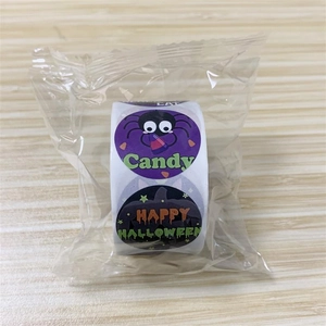 Detail of Halloween sticker roll with spider and pumpkin designs in plastic packaging