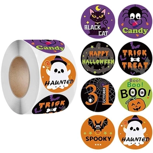 Detail of Halloween stickers featuring pumpkins, black cats and ghosts on a circular roll