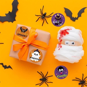 Detail of cartoon Halloween stickers on kraft gift box with festive spooky props