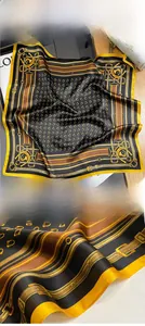 Detail of silk scarf showing equestrian patterns with plant dyeing and fine rolled edges