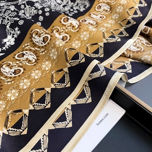 Silk square scarf with botanical chain patterns and hand-rolled edges in gold and black