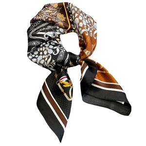 Silk scarf with plant chain print in black and caramel with hand-rolled edges