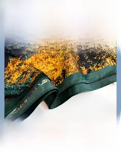 Detailed macro view showing the fine rolled hem and silk texture of this printed scarf