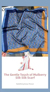 Close-up of premium Mulberry silk square scarf featuring classic blue and gold chain prints