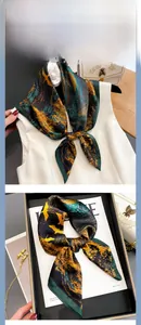 Detailed view of silk scarf with abstract oil painting texture and hand-rolled edges