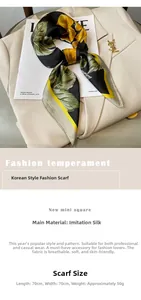 Detail of silk-like square scarf with yellow floral pattern tied on a light suit lapel