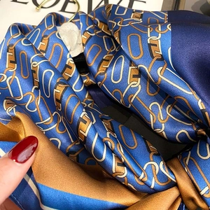 Navy blue and gold silk scarf with vintage chain print and elegant rolled edges