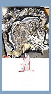 Detail view of the leopard and sunflower printed silk square scarf with hand-rolled edges