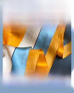 Detail of silk scarf with geometric color blocks and fine hemmed edge stitching