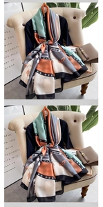 Detail of silk-satin scarf with color-blocking and abstract floral chain patterns
