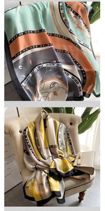 Detail of silk scarf with floral and geometric patterns on a beige chair