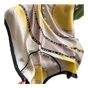 Elegant silk-like scarf with yellow lily flowers and geometric stripes for sun protection