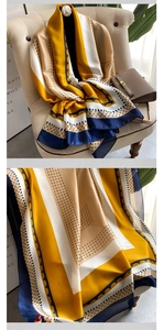 Close-up of luxury satin scarf featuring chain geometric patterns and silk-like glossy texture
