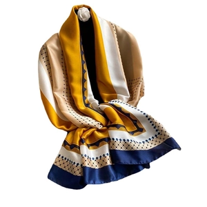 Elegant satin silk scarf in mustard yellow and navy blue with geometric patterns