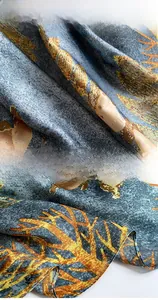 Close-up of silk-textured beach scarf with marble pattern and fine hem stitched edges