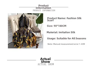 Detail showing 90x180cm silk scarf with golden leaf pattern and black base