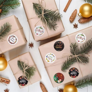 Festive Merry Christmas round stickers applied on brown gift boxes with holiday decor