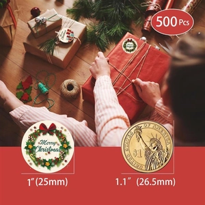 Detailed comparison of 1-inch Merry Christmas stickers next to a coin on gift boxes