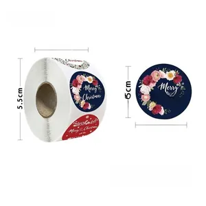 Macro shot of 500-pack Merry Christmas roll stickers showing 2.5cm diameter and dimensions