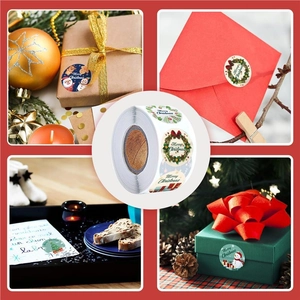 Roll of Christmas stickers with Santa and reindeer designs for festive gift wrapping
