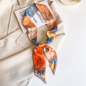 Artistic oil painting style silk Twilly scarf draped on a chic off-white blazer