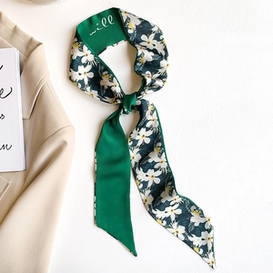 French style vintage green floral silk scarf tied in a stylish knot on a white background