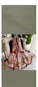 Close-up of vintage chain horse print scarf draped on an armchair in elegant room