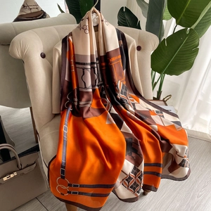 Elegant large equestrian silk scarf with horse bit pattern in orange and beige