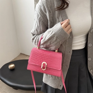 Pink crocodile pattern handbag with gold clasp and adjustable strap for women
