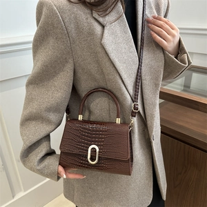 Retro dark brown crocodile pattern handbag with gold hardware and flap closure