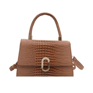 Brown crocodile pattern structured trapezoid handbag with gold oval lock and top handle