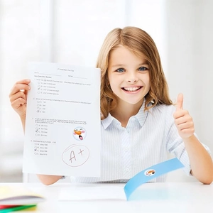 Smiling girl holding exam paper with A plus score and cute snowman reward stickers