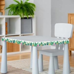 Detail of floral tropical plant border sticker applied to white children desk edge