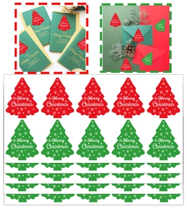 Close-up of Christmas tree stickers used on festive envelopes and greeting cards