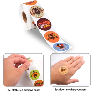 Roll of Happy Thanksgiving round stickers with turkeys and pumpkins on white background