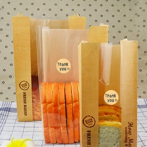 Close-up of kraft paper toast bags with Thank You stickers and transparent window