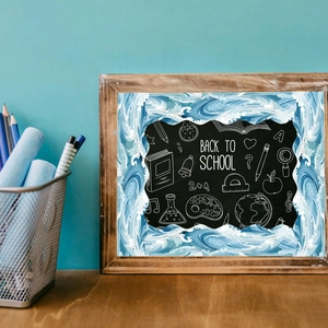 Close-up of back to school bulletin board border with blue wave pattern and chalkboard icons