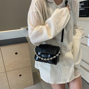 Chic black woven leather crossbody bag with silver bead chain and shoulder strap