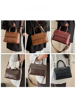 Dettaglio di borse tote in ecopelle coccodrillo in quattro ricchi colori classici