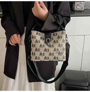 Detail of vintage bucket bag with ARCK jacquard print and adjustable wide shoulder strap
