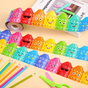 Detail of colorful crayon-themed bulletin board border roll with cute emoji faces