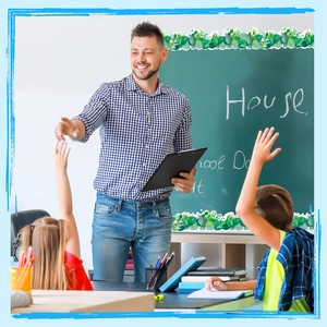Teacher in classroom using floral and eucalyptus leaf pattern scalloped bulletin board borders