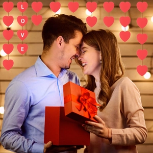 Romantic red heart paper garlands with white LOVE letters for Valentine decor