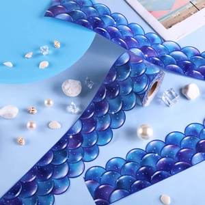 Detail of blue fish scale bulletin board border with mermaid texture and wave edges