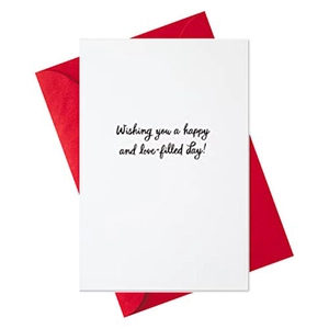 Folded white Valentine's Day card with red envelope and handwritten greeting message