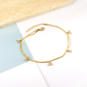 Detail of gold butterfly double-layer anklet with zircon accents and lobster clasp