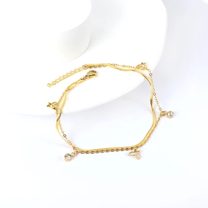 Close-up of double-layer butterfly anklet with round zircon charms in gold finish