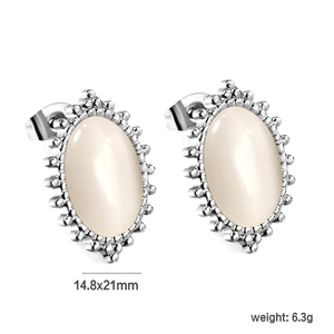 Detailed view of vintage oval stainless steel studs with white cat eye stone 14.8x21mm